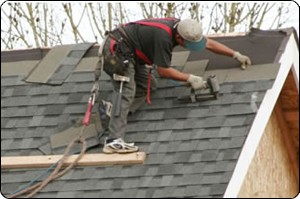 roffing employee working on a roof