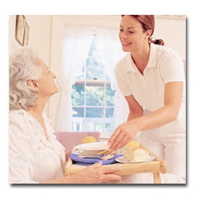 Caregiver assisting an elderly patient