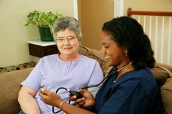 home health care aid with a patient