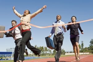 businesswoman crossing the finish line