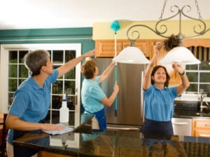 cleaning employees working in a residence